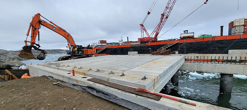 Construction of the new pier at Palmer Station in February 2022. Concrete decking sits on top of steel piles that support the new structure.