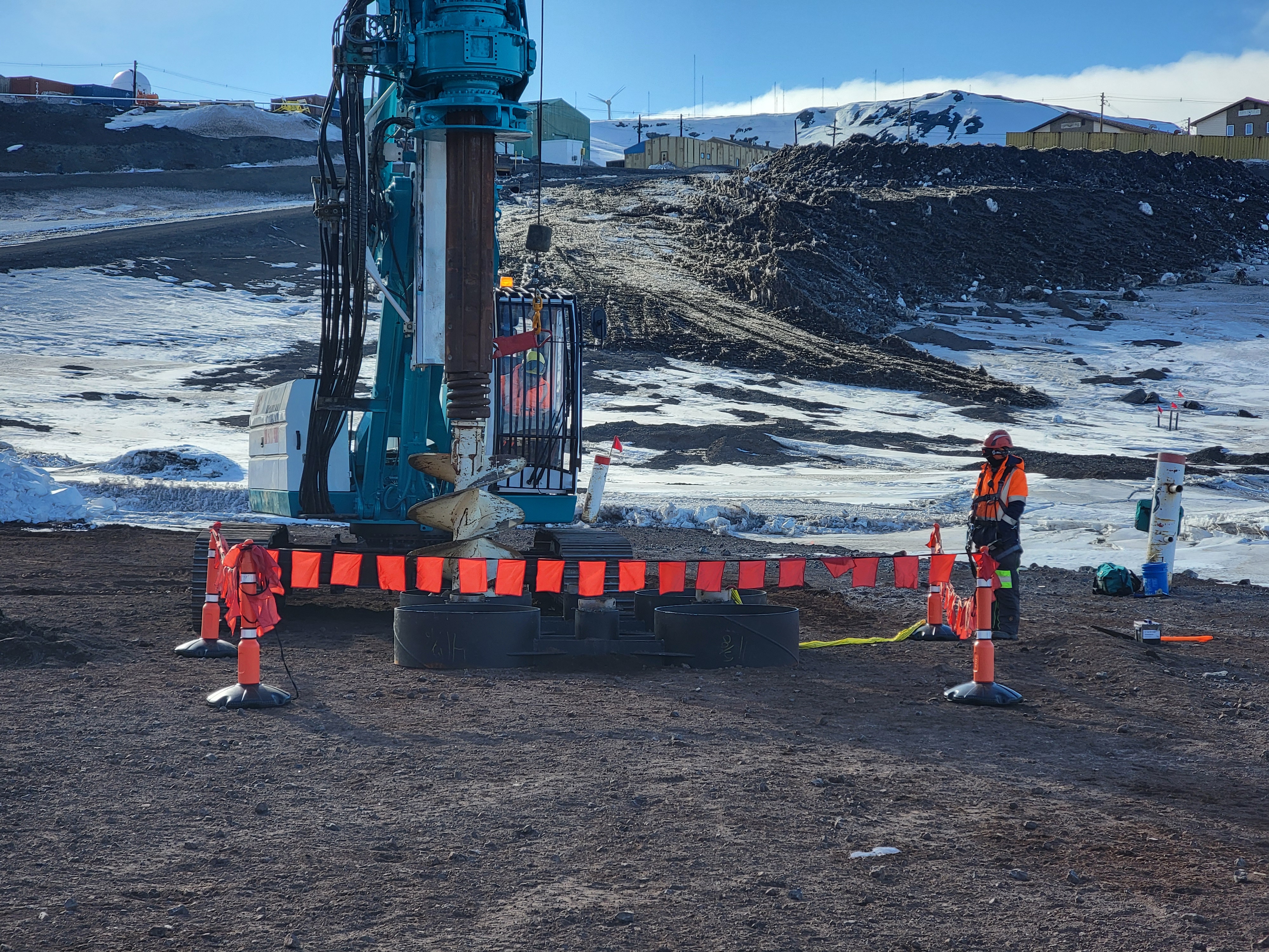 The Antarctica New Zealand contracted drilling team prepares a work point to install mooring piles at the wharf.